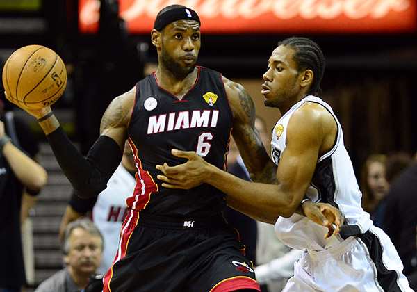 LeBron James was struggling on the Heat bench late in Game 1 on Thursday night. (Jesse D. Garrabrant/Getty Images)